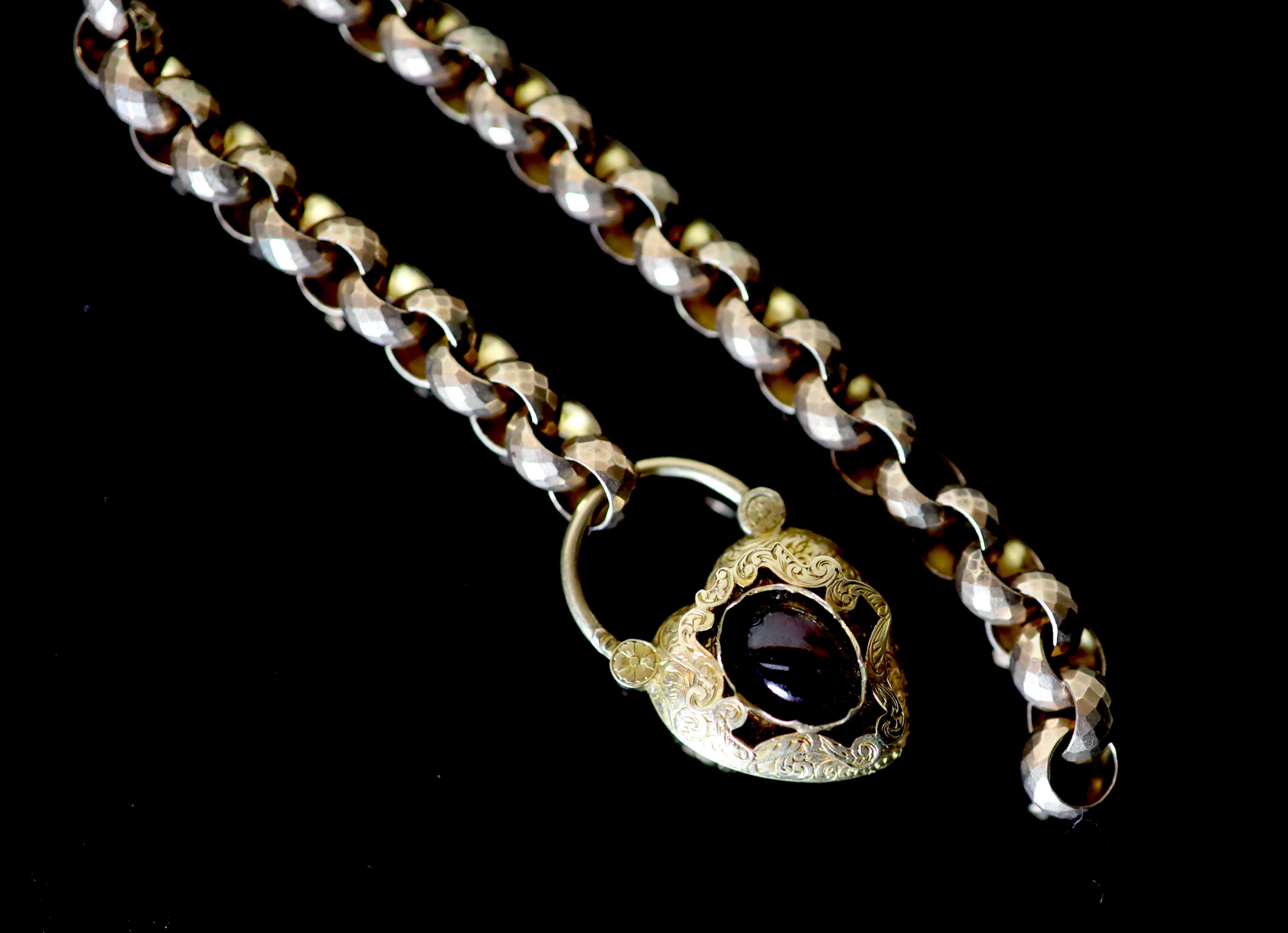A Victorian facetted gold link bracelet, with associated? engraved gold and cabochon garnet set heart shaped padlock clasp,